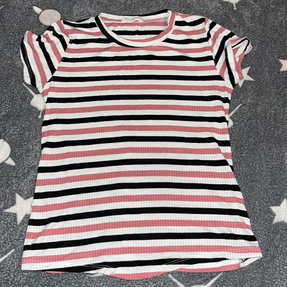This is a black,white and pink stretchy shirt.